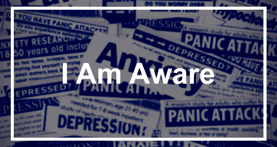 A collage of newspaper-style clippings with words like “Anxiety,” “Panic Attacks,” and “Depression,” with the phrase “I Am Aware” boldly overlaid in white text in the center of the image, framed by a thin white border.